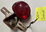Suzuki 1972 71 RV125 RV90 TS50 Oem TC100 MT50 Tail Light Complete Bracket Wires. Fixed Price $94.50.